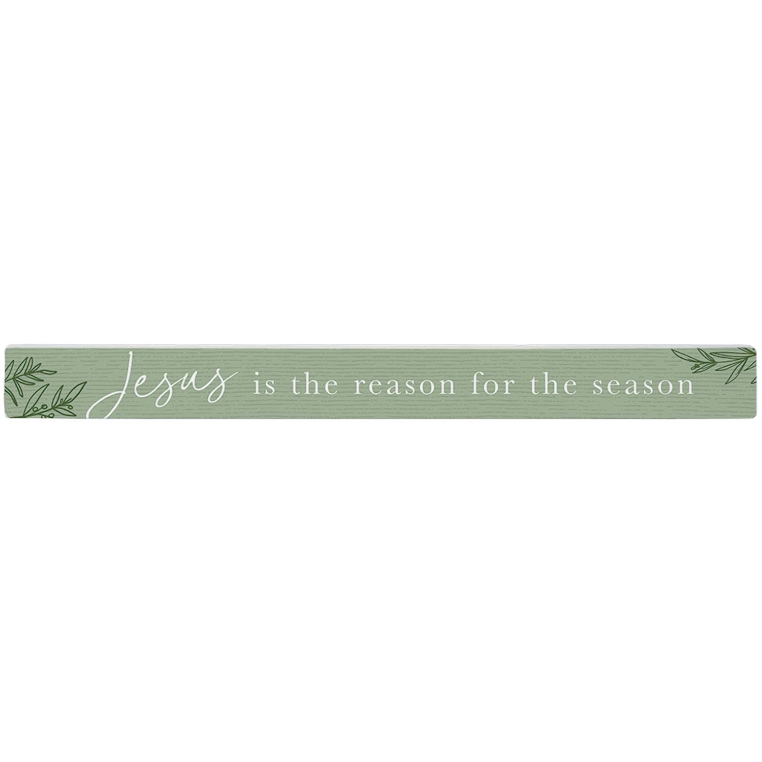 Green decorative sign with 'Jesus is the reason for the season' text 