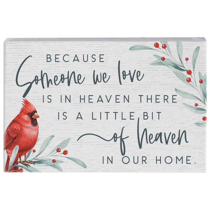 Decorative sign with a red cardinal, greenery, because someone we love is in heaven there is a little bit of heaven in our home